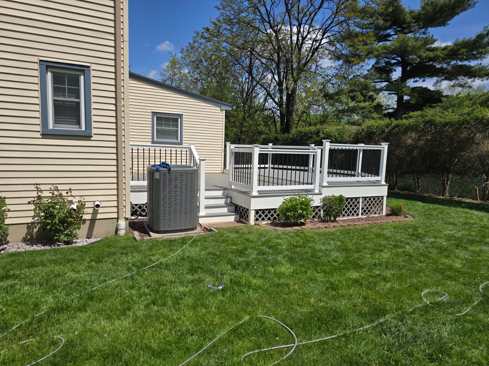 Raised deck angle view with bright white railings
